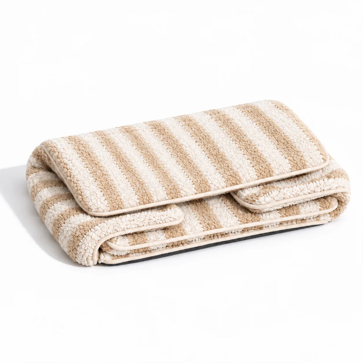 Beige and ivory striped faux lambswool pet sofa shown folded on a white studio background