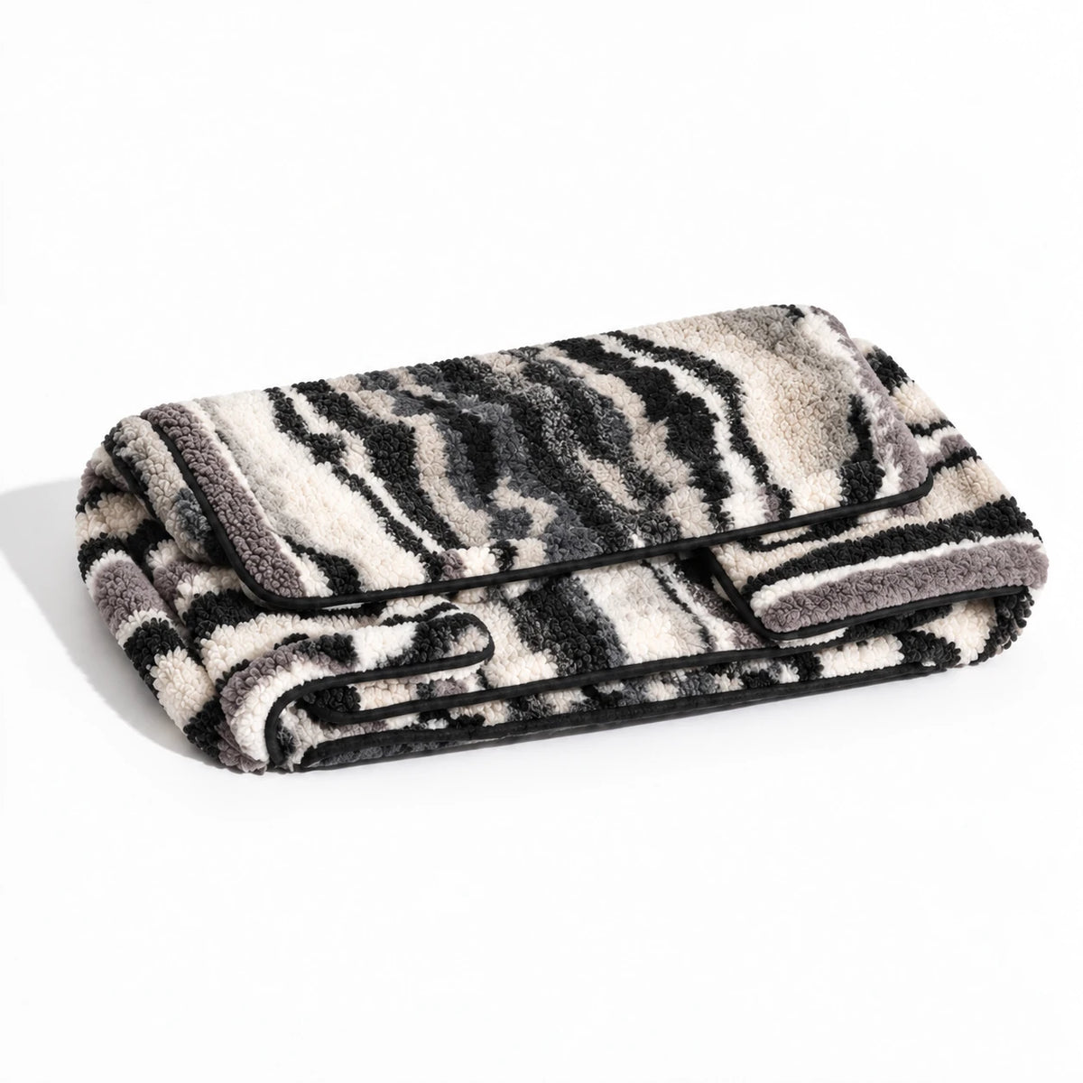 Gray, black and ivory irregular striped faux lambswool replacement sofa cover, folded, cover only.