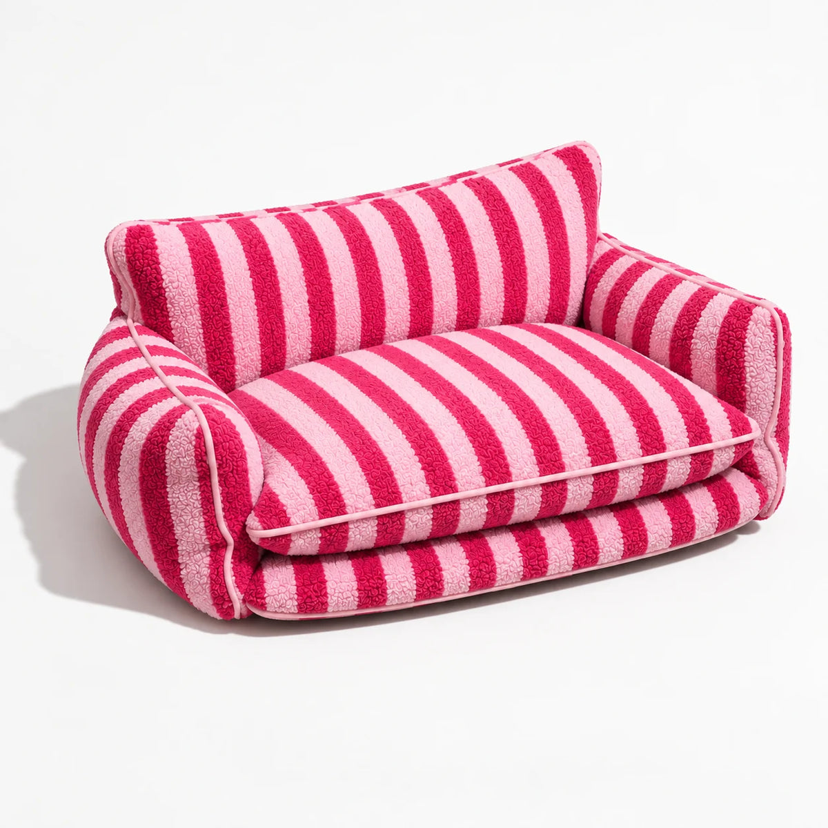 Rose striped faux lambswool pet sofa bed showing the double-layer cushion and padded arms on a light studio background