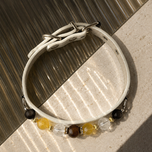 Full Sunlit Halo pet jewelry collar showing its closed shape, white base, hardware, and decorative front.