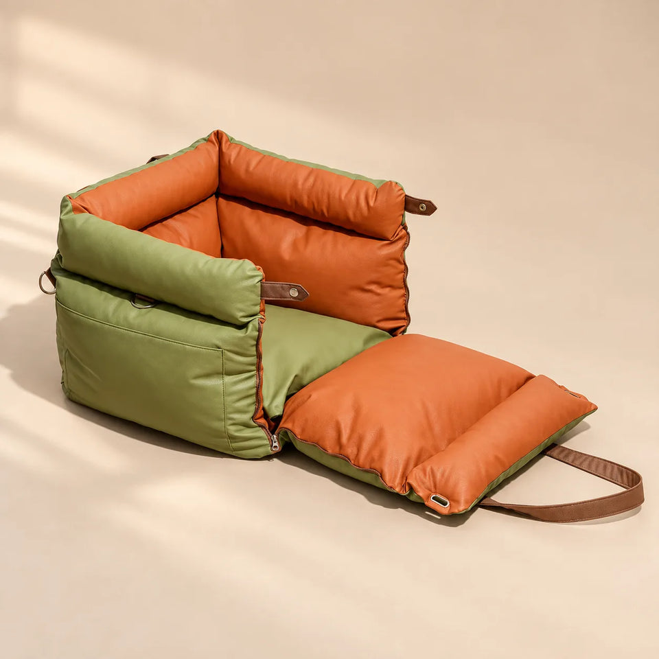 Olive green and orange pet carrier with its front panel folded open