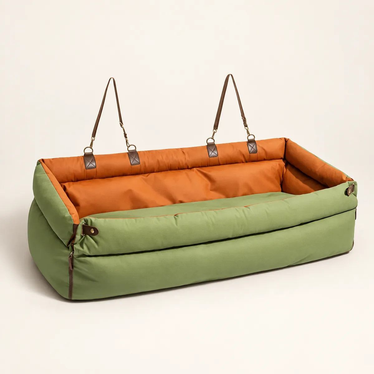 Olive green and orange long pet car seat bed on a warm cream background